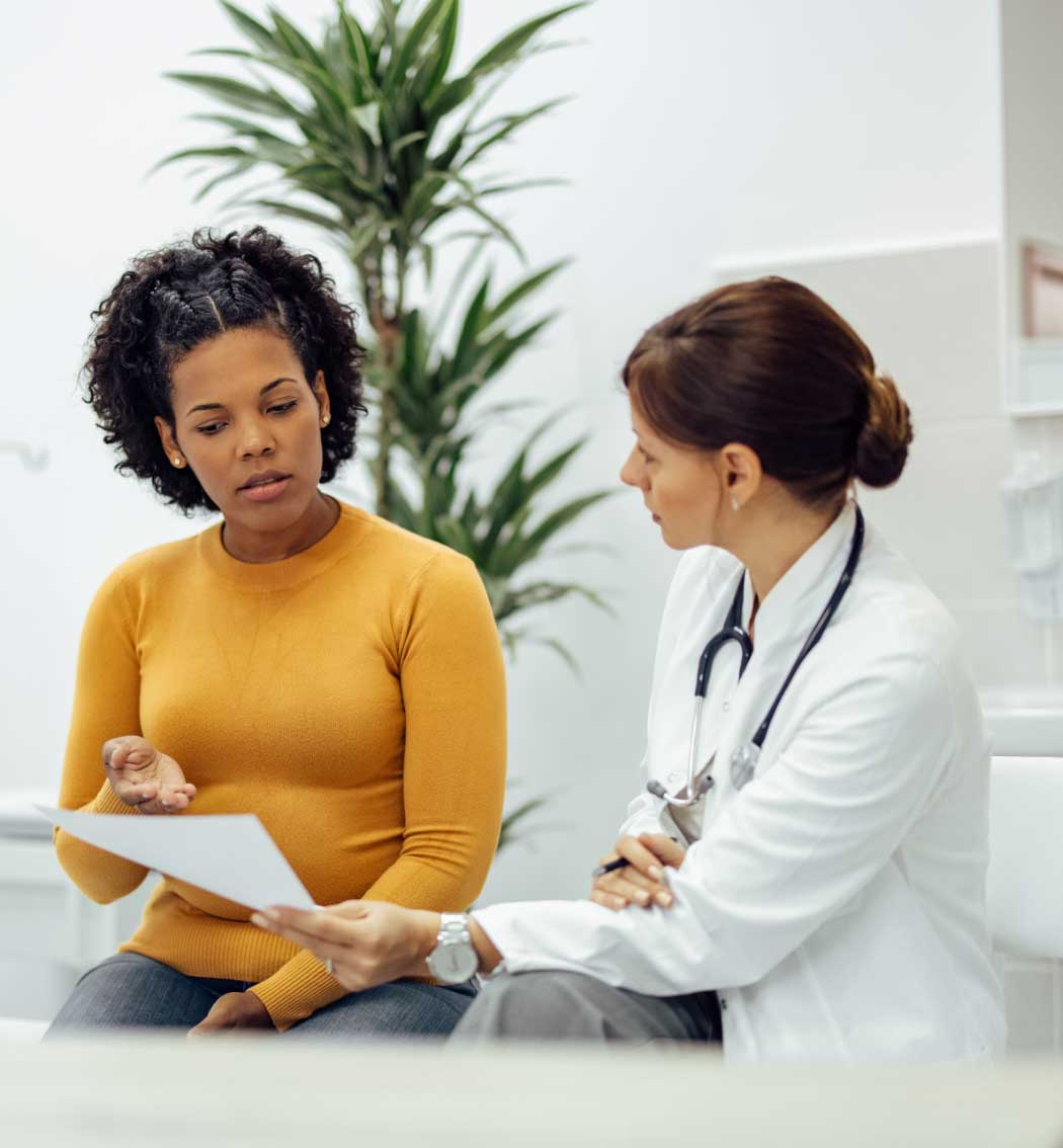 woman discussing dosing options with her doctor